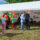 Vereinsstand auf Stadtteilfest mit Besuchern, Glücksrad, Taekwondo-Banner und guter Stimmung.